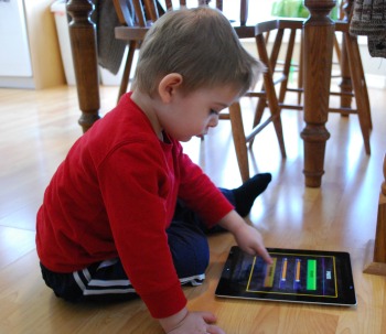 Child playing with iPad